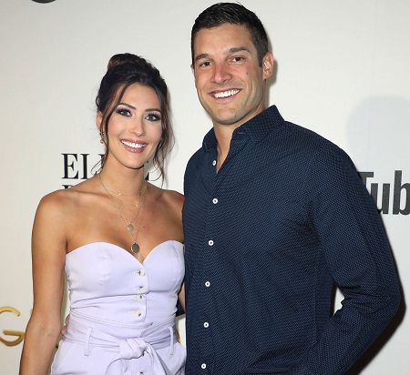  Becca Kufrin and Garrett Yrigoyen are seen at ABC's "Grand Hotel" Premiere on June 10, 2019 in Miami Beach, Florida.